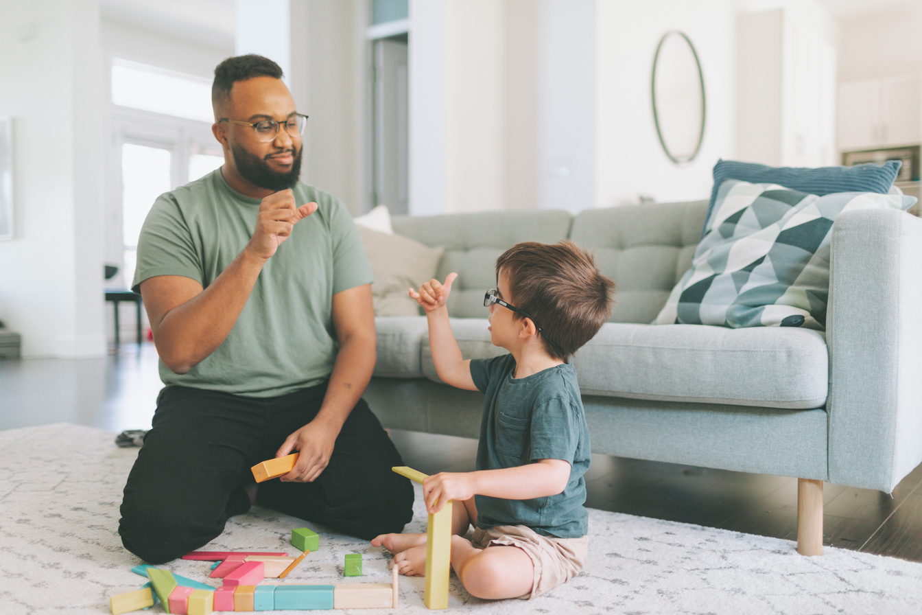 Little Boy and Teacher Communicating with Sign Language